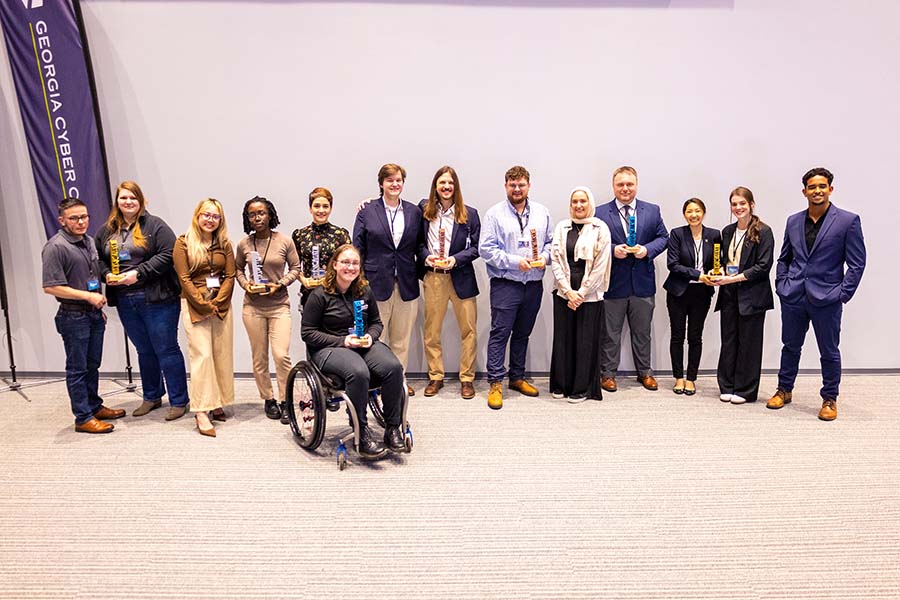 Group of winners with awards