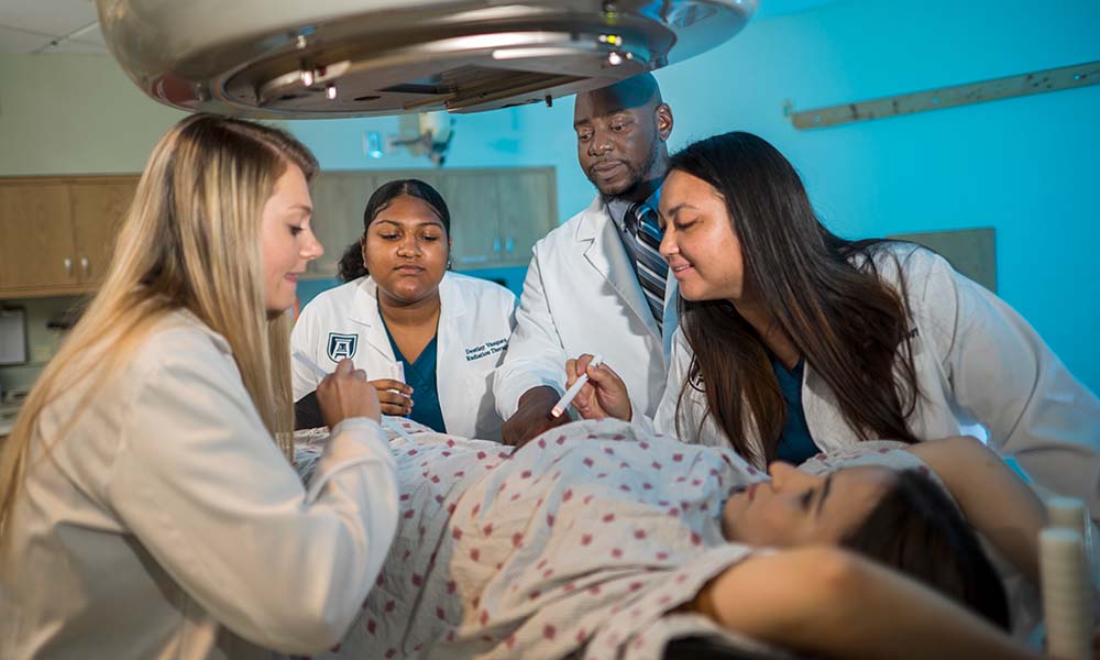 Radiation Students examining patient