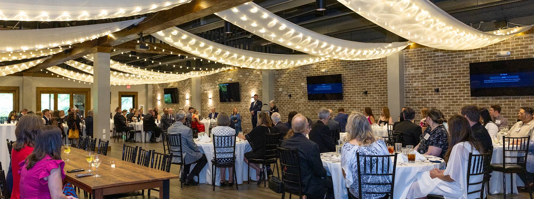 people seated at dinner tables