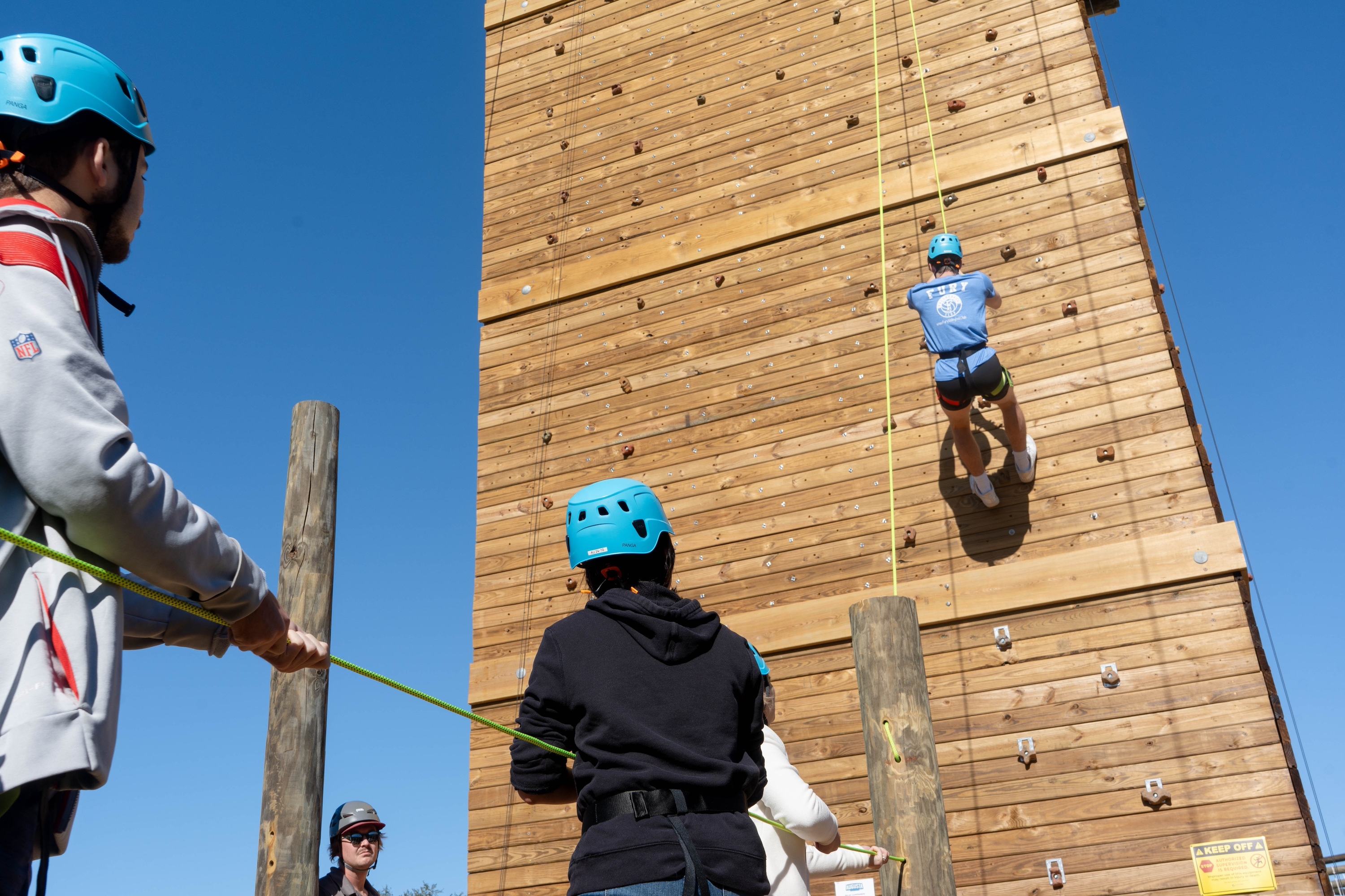 student on climbing wall