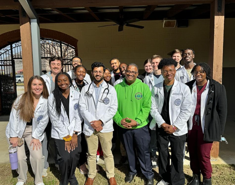 Photo of a group of students in white coats