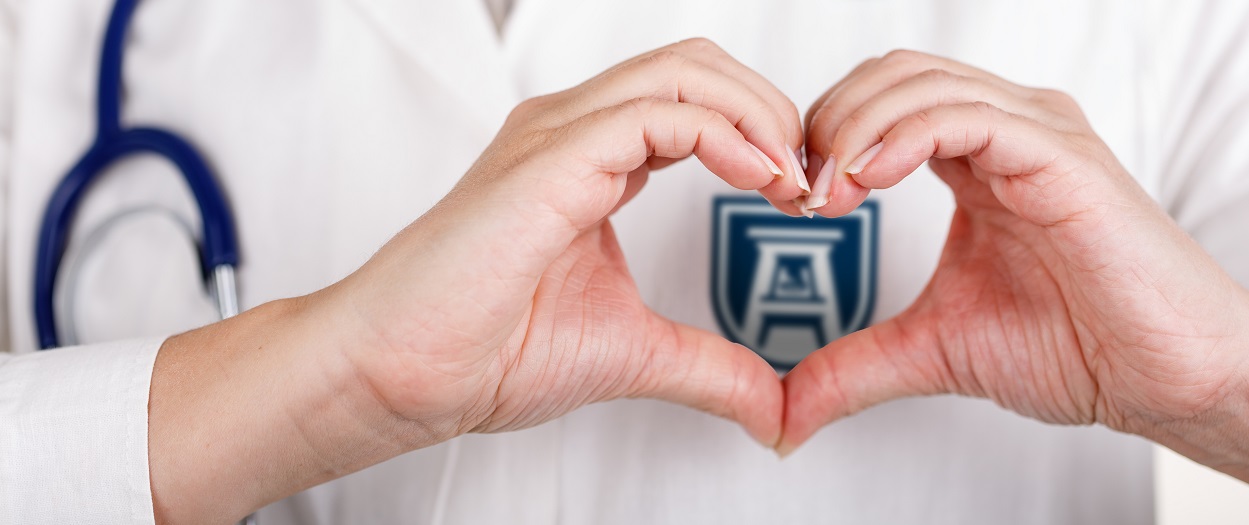 Hands making heart shape over Logo