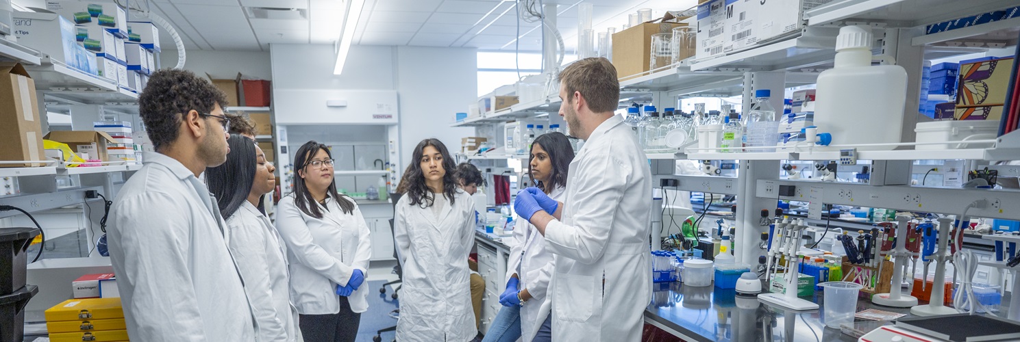 Dr. Goldstein with students in lab