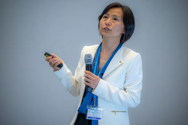 Dr. Qin Wang teaching/ speaking
