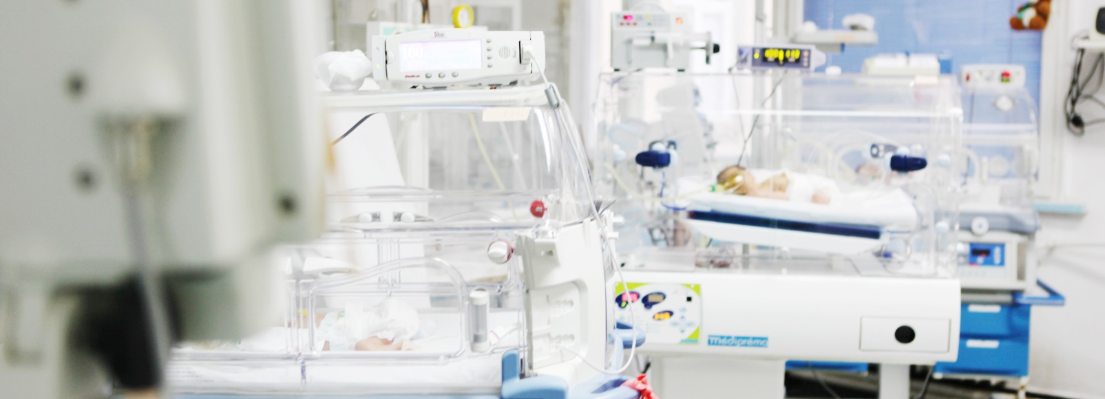 babies in the nicu surrounded by equipment