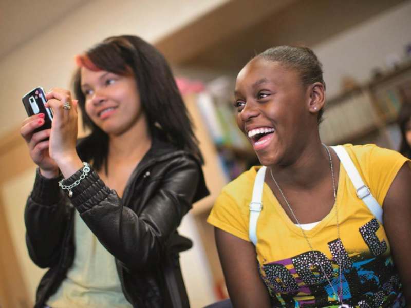 two girls laughing