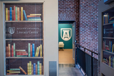 The literacy center logo on a door