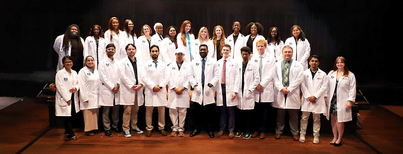 students in their white coats