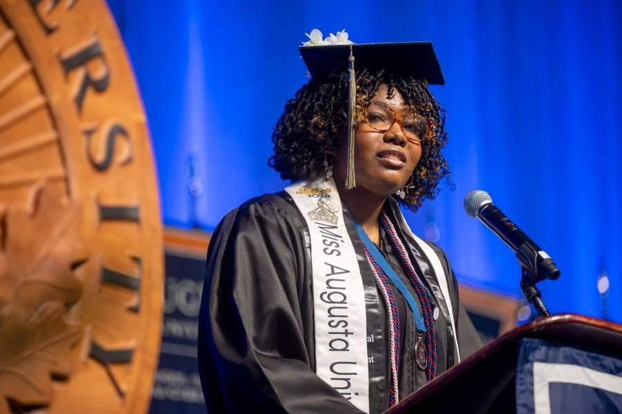 woman speaking at podium