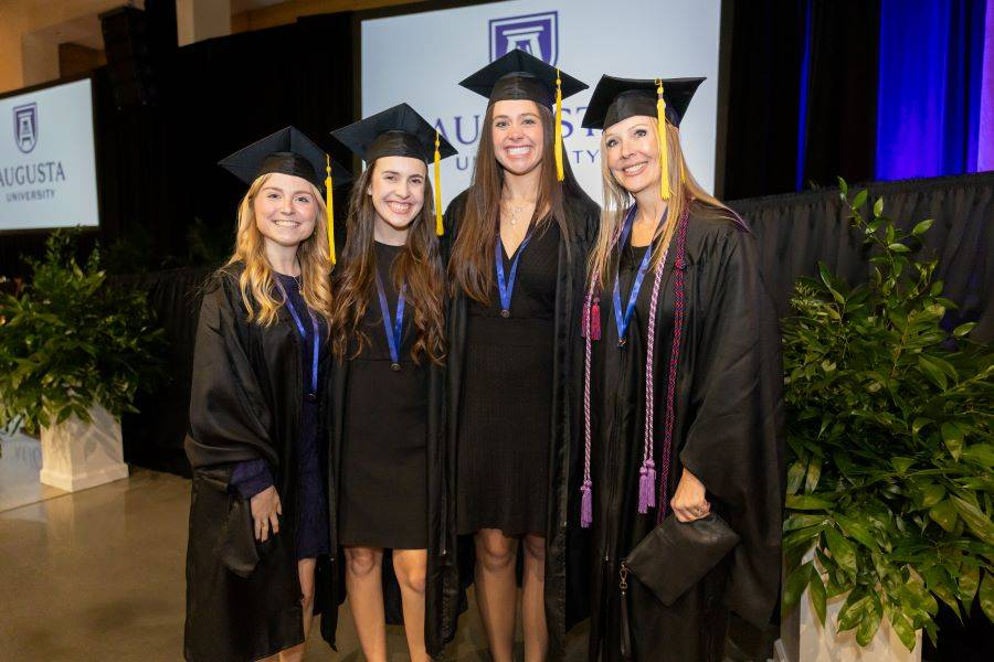 four girls standing together