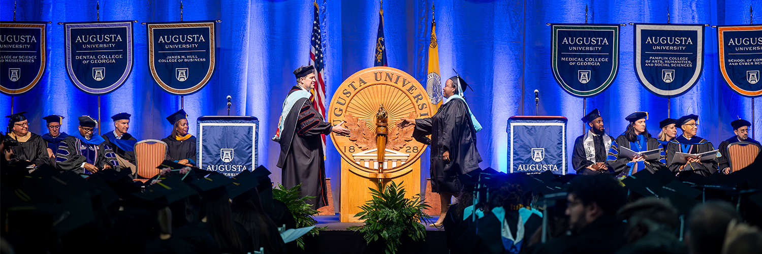 Students at the commencement ceremony in 2024 with President Keen