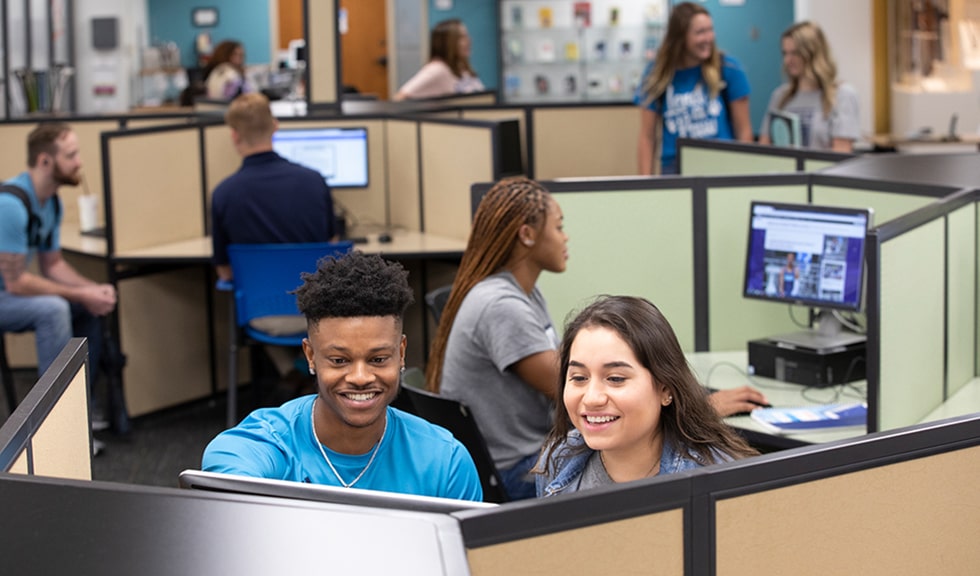 Students in the cyber cafe on the Riverfront campus