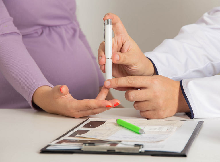Doctor giving a test to a pregnant woman