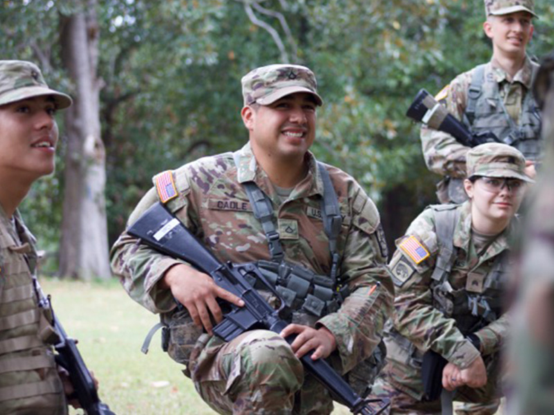 Cadet smiles while holding rubber M4