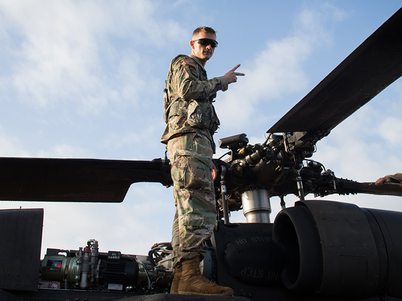 Cadet stands at the top of a military helicopter