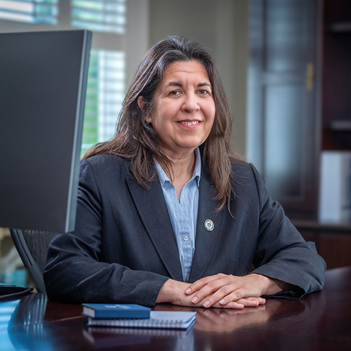 Provost Tomova seated at her desk