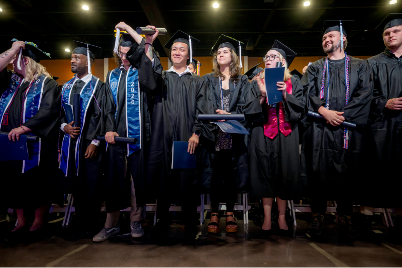 students turning tassels at graduation