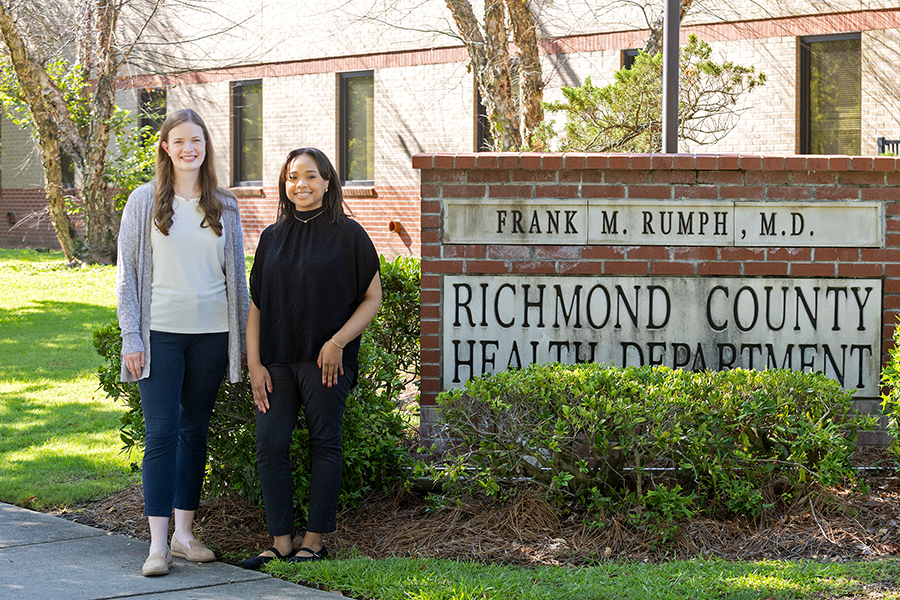 Female student interns standing outside the Richmond County Health Department