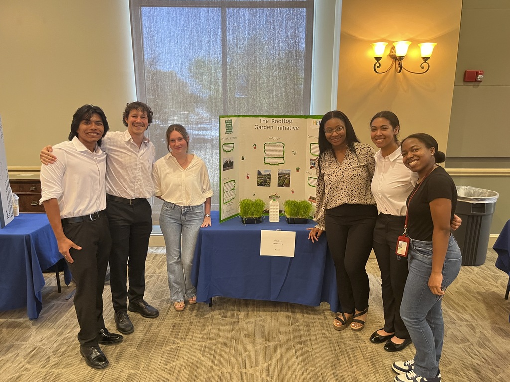 Students around a presenter board