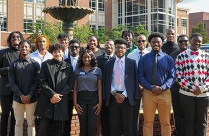 Group photo of the African American Male Initiative on campus in front of the fountain