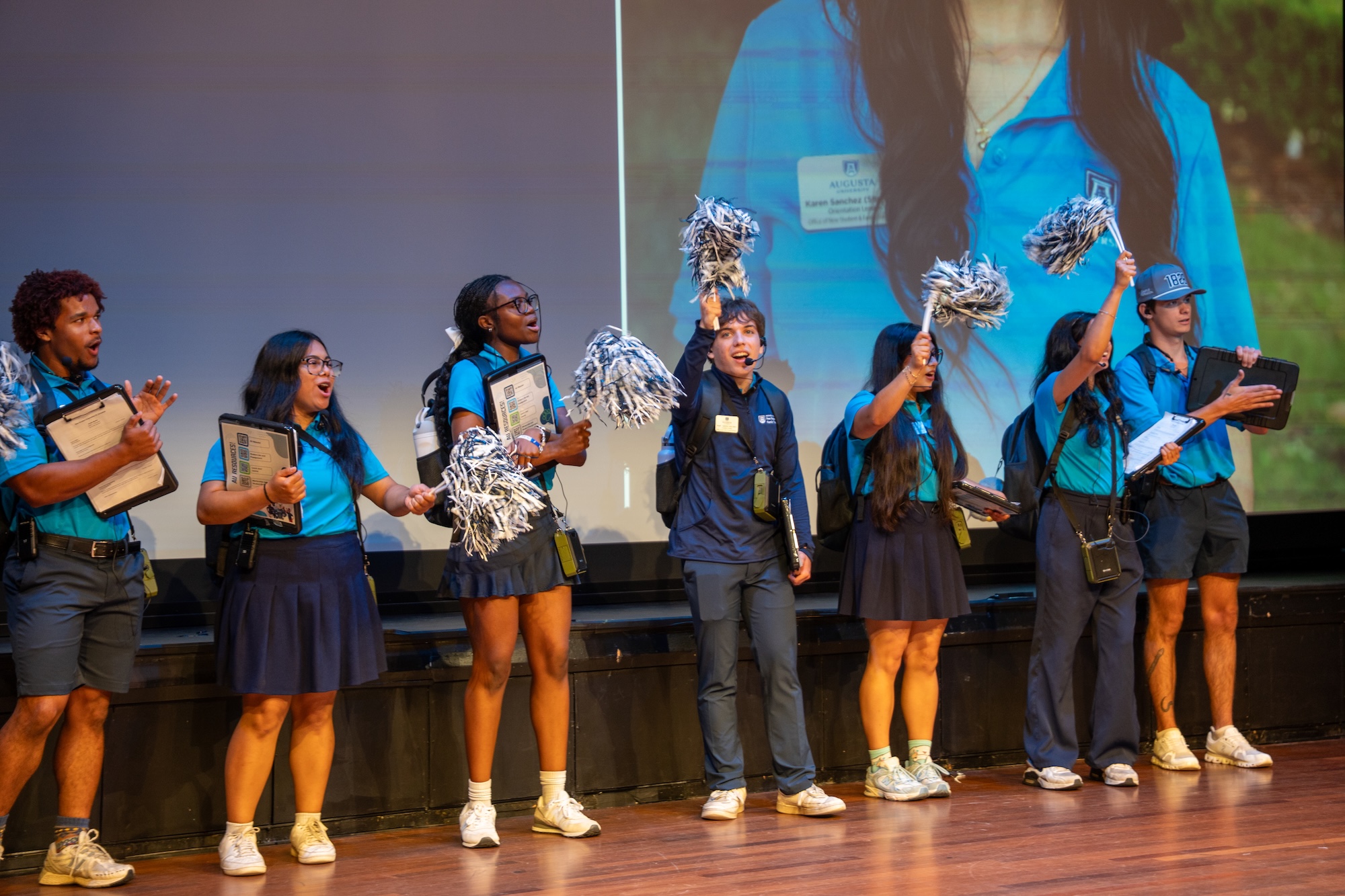 Orientation Leaders cheering in theatre
