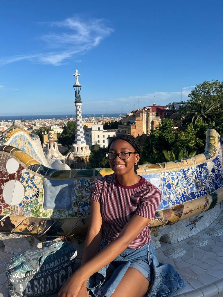 girl sitting in a stone garden