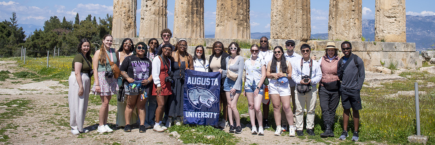 AU students abroad with thank you sign