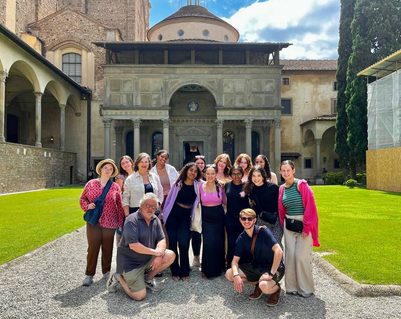 students posing in front of an italian building