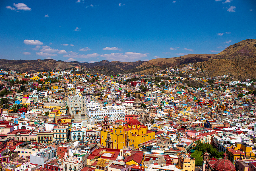 colorful buildings surrounded by mountains