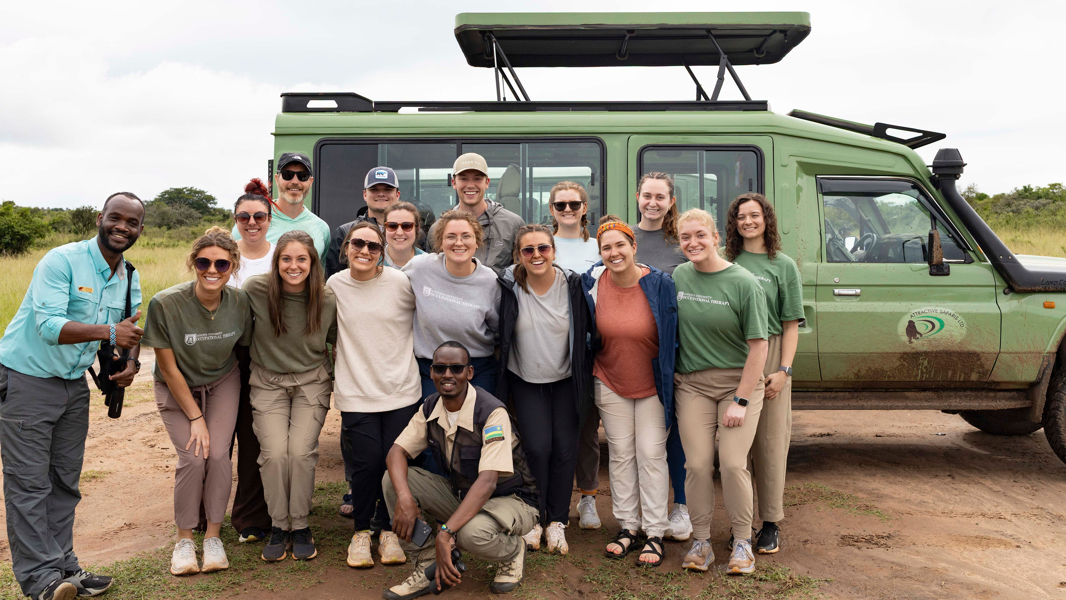 Augusta University Professor Ryan Carrick poses with a group of students in Rwanda