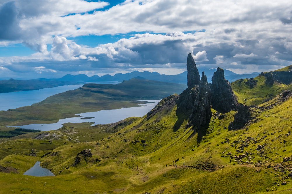 green hills atop a body of water