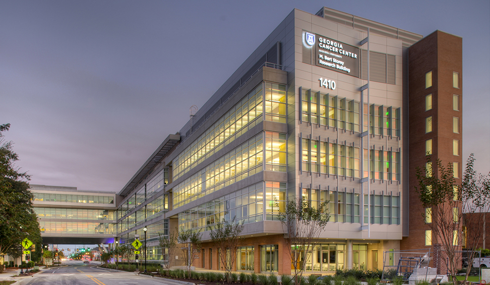 Exterior view of the Georgia Cancer Center building at night